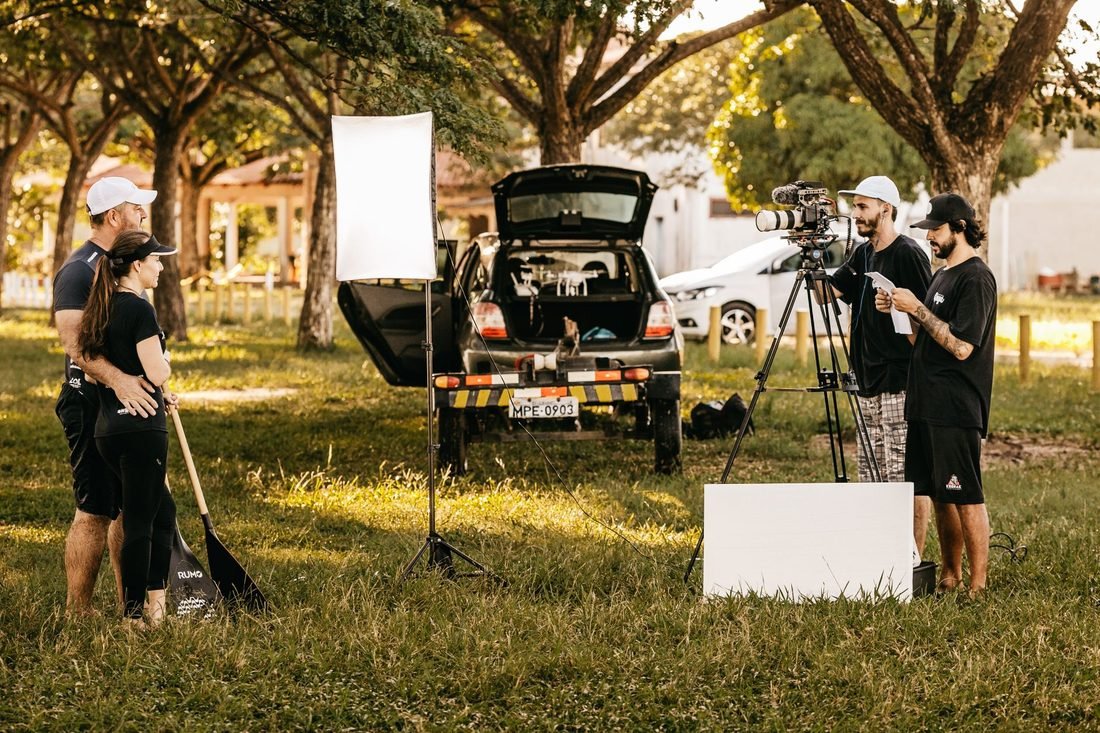 Film unit with camera, lighting and production vehicles on location
