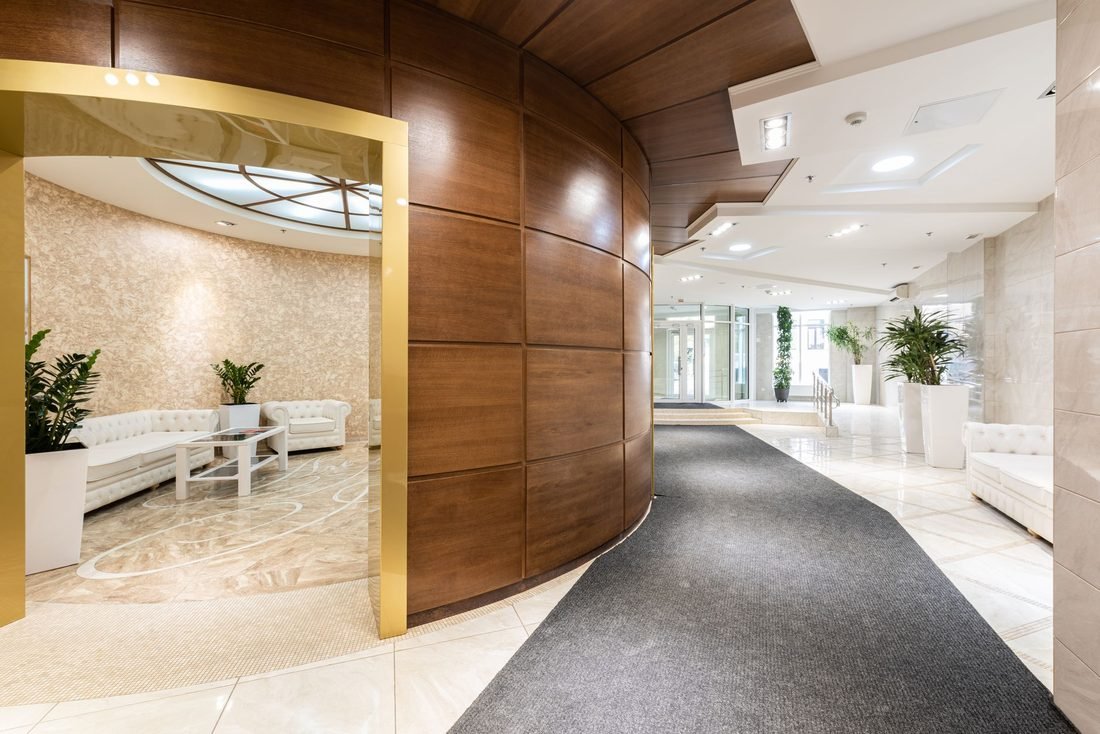 Calm wood-panelled corridor of a modern private hospital
