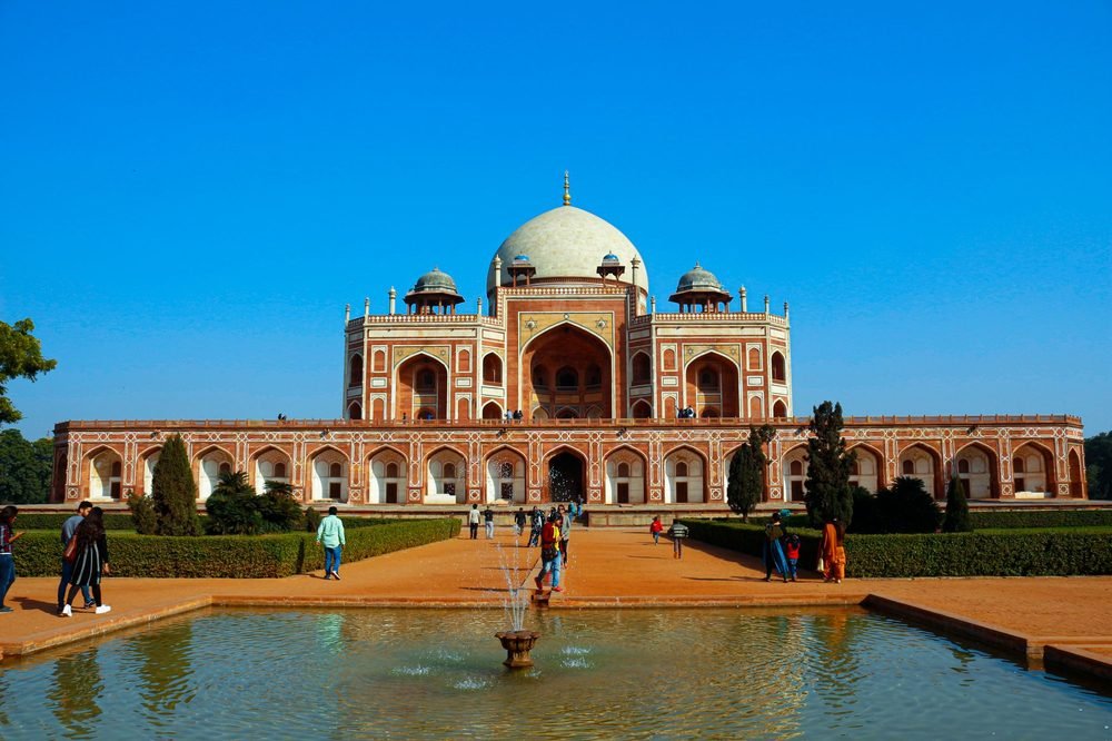 Visitors at Humayun's Tomb, Delhi, with a guided group
